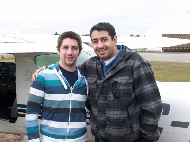 Tyler getting greeted by his instructor Antwan after taxiing back to the club