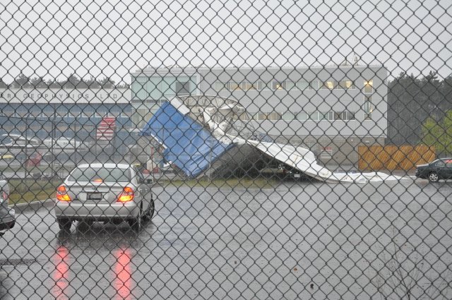 Hangar damage following a wind storm.