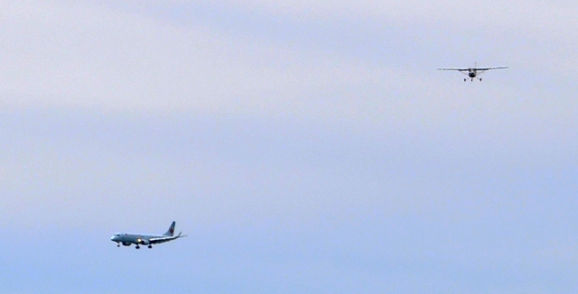 Watch for traffic on final: Hannah Ferguson on her first solo flight on final for 04 with an Air Canada jet on final for 07.