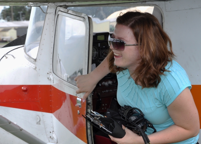 First Solo!: Hannah, happy as she leaves the plane and is greeted by her parents, friend and instructor.
