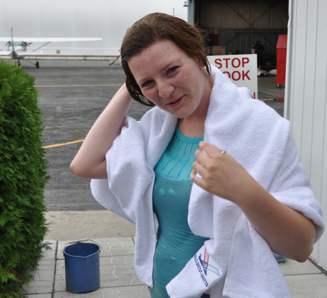 Drying off with a OFC Towel: Hannah dries off after getting soaked.  To add some dignity to the celebration, we now hand out towels that the students can keep as a memento of the event.