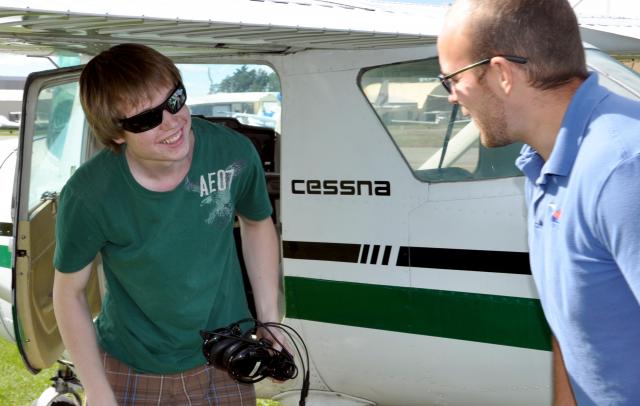 Post Solo: Matthew Little being greeted by Mark Rogulski after Matthew's first solo flight, 20 September 2010.