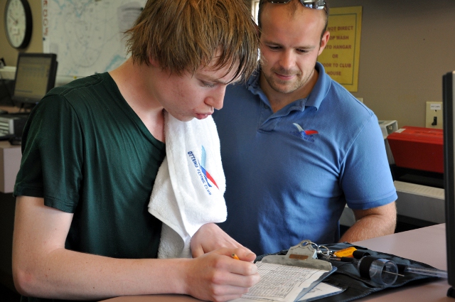 Post Solo Paperwork: Mark Rogulski leads Matthew Little through the post solo paperwork after Matthew&amp;#039;s first solo flight.