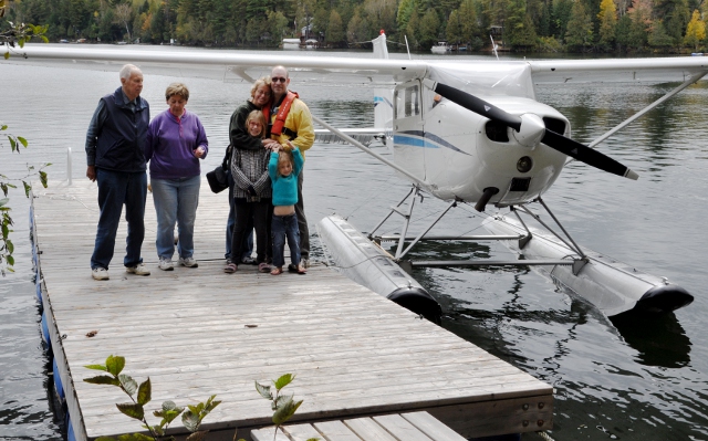 Making an Impression: My family posing with me after Jeff Mavor and I land his plane on Johnson Lake, near Ladysmith in Quebec.