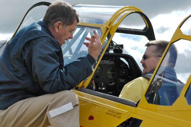 Preflight: John Aitken from Vintage Wings briefs Aaron Nichols prior to a short flight in the Vintage Wings Harvard.