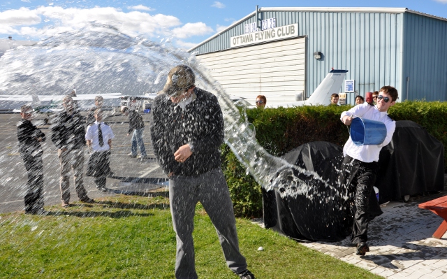 Jeff's Splash: It was a good day for the customary soaking that comes along with Jeff's first solo flight.