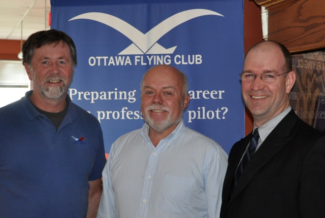 Peter Campbell becomes an Instructor: Peter, centre, with John Porter, CFI, and Mike Mckay the CEO after Peter received his Instructor Rating.