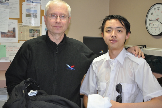 A Little Damp: Kenny with Instructor Frank Faludi, following his first solo flight.