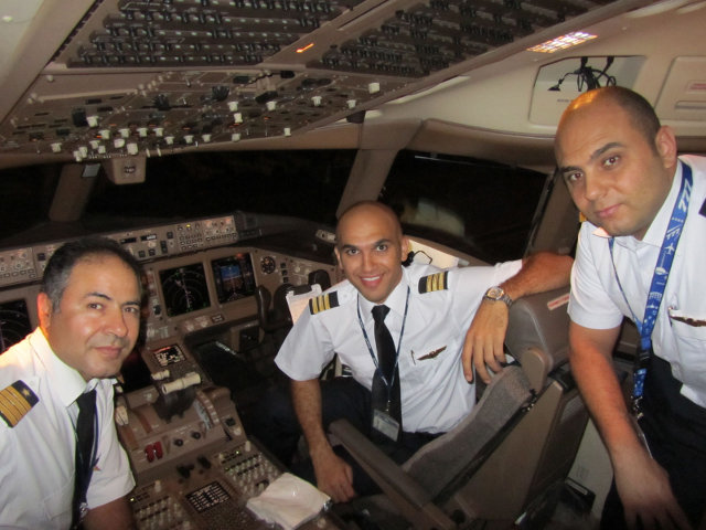 Mostafa Badr, PPP Class of '04: Mostafa Badr (Fex), center, was recently promoted to the right-seat of an Egypt Air Boeing 777.  On this happy occasion, he sent us the following note: "This is mostafa hamed badr i was one of the students in ottawa flying club about 7 years ago i attended full professional program in ottawa 2003 I am so happy to pronounce that I am flying the Big giant now B777-300ER after flying the b737-800 for about 5 years with egyptair yahoooooooo:)  It's a a great plane to fly and i am really enjoying flying this monster. I always thanks everyone on board of Ottawa flying club who makes me achieve to be an airline pilot. Thank thank guys for make me earn a golden wings from your club. Special thanks to:  Gerry Thompson, Andrew Mackenzie, and George Manchave"