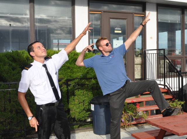 Peter and Simon showing some attitude.: Simon Auger shows Peter the proper way to attract attention.  Simon has significant experience in this area.  Having traveled the world, he has left his impression on many and you will often see flashes of the same bravado in the signature moves of several celebrities, including Usain Bolt.  Peter, having just flew solo, obviously needs more practice to reach the same level of inhibition.